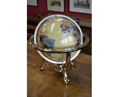 A 20th century library globe, inlaid with abalone and specimen stones