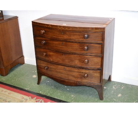 A George III mahogany bow front chest of drawers, crossbanded caddy top, four cockbeaded graduated drawers, button handles, s