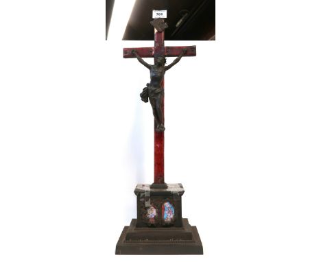 An enamelled copper christ on cross with iron base Condition Report: damage to enamel and attention needed to piece 