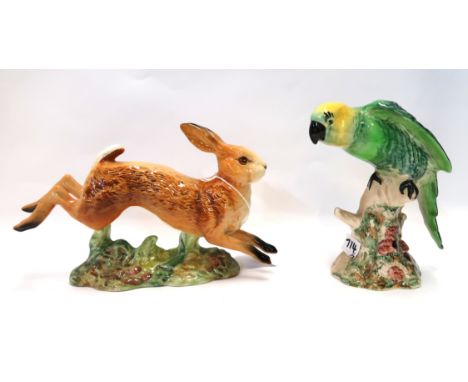 A Beswick model of a Hare, no 1024 and a model of a Parrot, no 930 Condition Report:parrot has a small chip to the naturalist