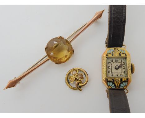 A 9ct gold citrine brooch, 9ct case ladies vintage watch with enamel detail and a yellow metal pearl shamrock from a brooch C