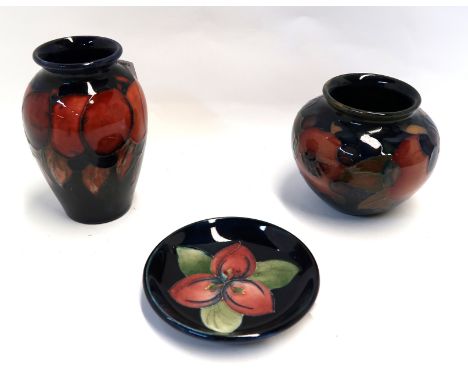 A Moorcroft miniature flambe wisteria pattern vase, 9cm high, a squat pomegranate pattern pot and a trinket dish Condition Re