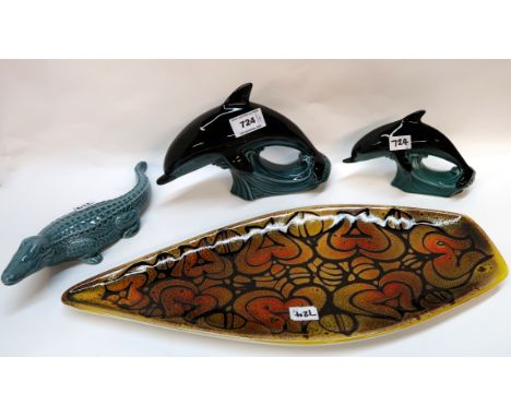 A Poole pottery dish, two models of dolphin and a crocodile Condition Report: Available upon request