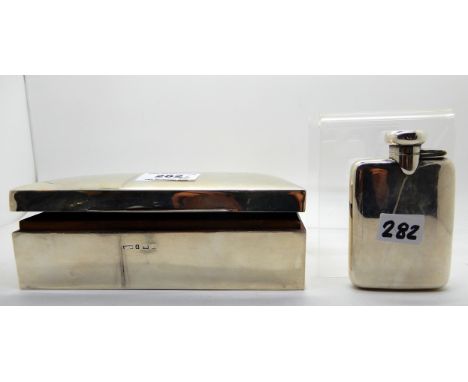 A lot comprising a silver cigarette box, 18cm x 9cm, rubbed Birmingham marks with a small spirit flask, Birmingham 1914, 9.5c