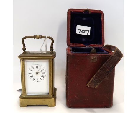 A miniature brass and glass carriage clock in travelling case, with key Condition Report: Dial cracked Winds but not currentl