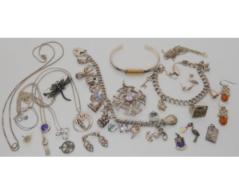 Two silver and white metal charm bracelets, a silver and amethyst Celtic cross pendant and other items Condition Report: Not 