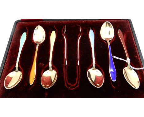 A cased set of six sterling silver and enamel coffee spoons with tongs Condition Report: Good condition.