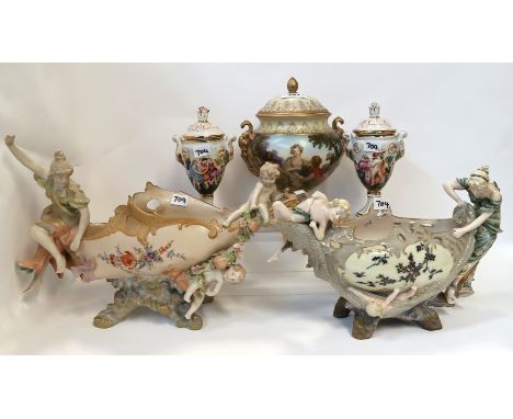 An Austrian porcelain centrepiece decorated with a maiden and cherub, a Turn Wien example, a urn and cover and a pair of capo