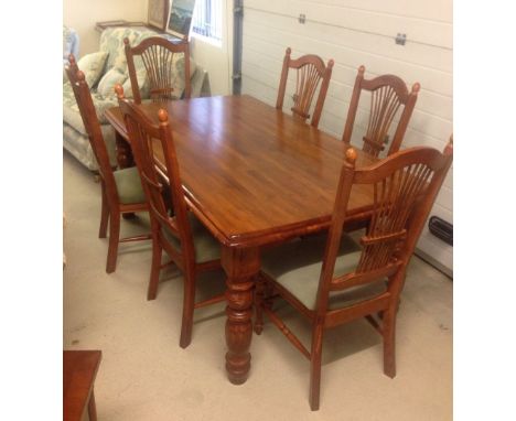 A dining room table &amp; 6 chairs - heavy turned legs to table &amp; stick back chair.