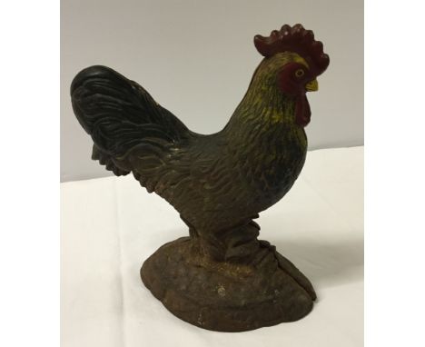 A vintage cast iron cockerel. 30cm tall.