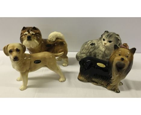 4 ceramic dog and cat figures - Coppercraft Labrador, Akita & Persian cat, and a Token Pottery Yorkshire Terrier.