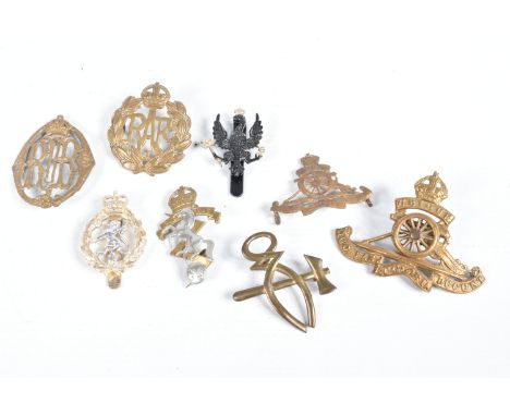A SMALL AMOUNT OF CAP BADGES FROM DIFFERENT ERAS, to include RAF, a distressed RA badge, REME, a staybright womens Royal Army