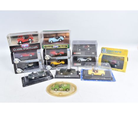 A QUANTITY OF BOXED TRIUMPHS TR3 MODELS, to include a Vanguards model VA04703 in British Racing Green, a Corgi classics soft 