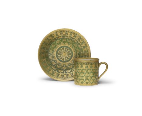 A Sèvres green-ground cup and saucer, circa 1811Decorated in gilding with a broad band of foliate motifs, around a central fo