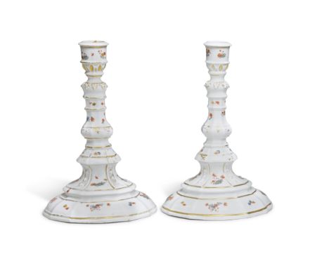 A pair of Meissen candlesticks probably from the Japanese Palace, circa 1735-37The flared, stepped foot moulded with panels o