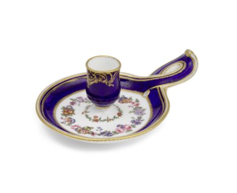 A rare Sèvres blue-ground chamber candlestick (bougeoir), dated 1767The bleu-lapis ground band edged with gilt dentil borders