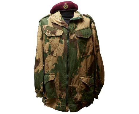of regulation bright camouflage cloth with full zip to the front and Newey studs to the flapped pockets, the shoulders with r