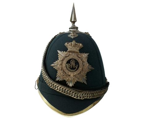 the blue cloth covered skull with white metal mounts, the crowned rayed star helmet plate surmounted by a laurel wreath, cent