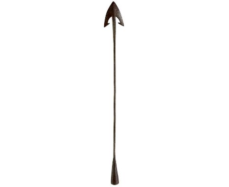 head forged with twin barbs and stop withers, curved cutting edges, integral iron shaft swollen at the head, open socket pier