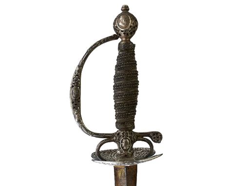 72.5cm incurved triangular section blade decorated with scrolling foliage to either side and stands of arms at the forte, all