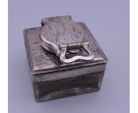 A silver topped glass inkwell. 4.5 cm square. 