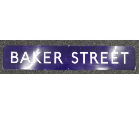 An original Baker Street enamel railway sign and a copy of Sherlock Holmes My Life and Crimes book. 149 cm long x 27 cm high.