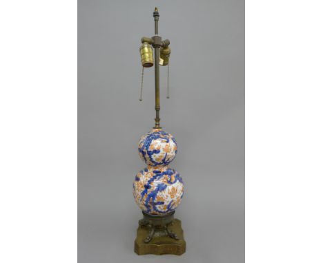 An Imari double gourd vase mounted as a lamp. The vase section 27 cm high.