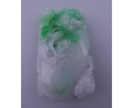 A two tone jade pendant. 5.5 cm high.