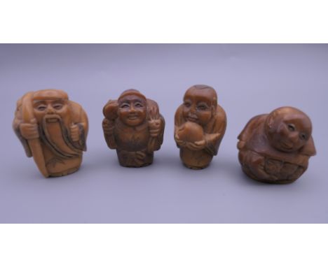 Four carved netsuke. Each approximately 3.5 cm high.