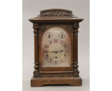 An early 20th century oak cased Westminster chime on gong mantle clock. 44 cm high.