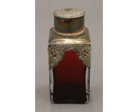 A silver mounted ruby glass caddy. 12.5 cm high.