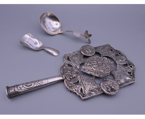 A 19th century Dutch silver hand mirror (lacking glass), a 19th century Dutch silver caddy spoon and a small 19th century Dut