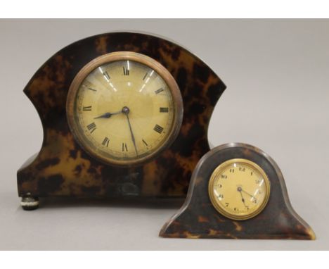 A mantle clock and a desk clock. The former 15 cm high.