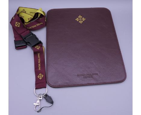A Patek Philippe mouse pad and key holder.