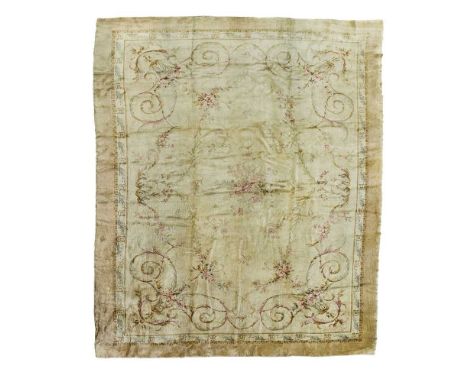 the cream field with floral spray medallion, scrolling acanthus and floral surround, within plain light brown border558cm x 3