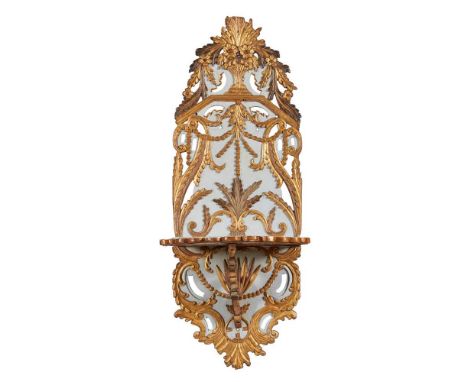 the back panel carved with bead swags, flowers, and and foliate scrolls above a single shaped shelf37cm wide, 97cm high, 33cm