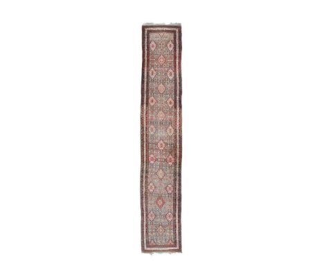 the camel field with allover cartouche and foliate lattice pattern, within narrow ivory stylised vine border560cm x 110cmProv