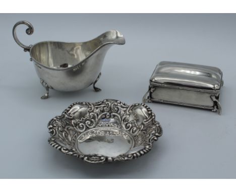 Walker and Hall, a George V silver sauce boat, Sheffield 1926, a silver bon bon dish and a ring box. Various dates and makers
