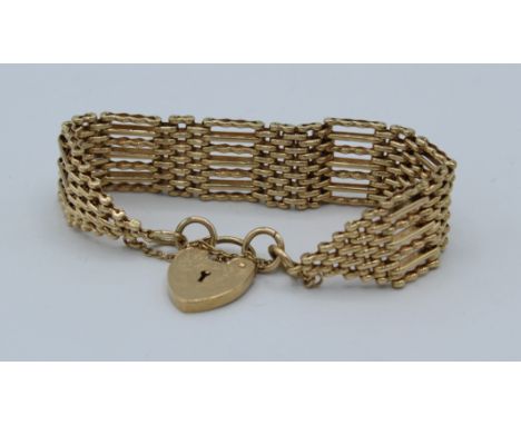 A seven bar 9ct gate bracelet. A combination of patterned and straight bars. 34.8gm