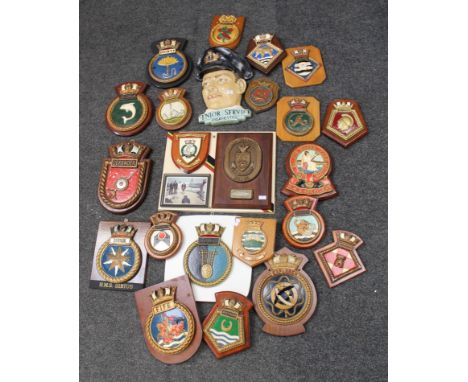 A collection of twenty one mainly cast metal mainly Royal Naval ships commemorative plaques of various sizes and a ceramic wa