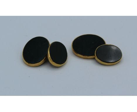 A pair of 1960's 18 carat gold bloodstone set chain cufflinks of oval panel form. Largest stones 2 x 1.5cm. Gross weight 11gm