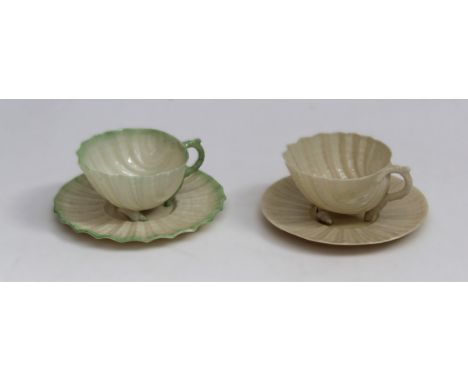 Two Belleek porcelain teacups and saucers, each cup raised on whelk feet&nbsp;