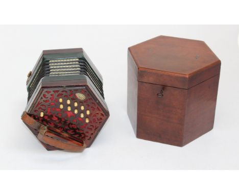 A 19th century Lachenal twenty one button concertina. Number 114535, in fitted mahogany case&nbsp;