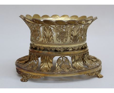 A large silver gilt fruit bowl hallmarked for London, 1804 complete with original glass liner. Matching grape and vine decora
