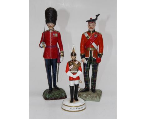 A Sitzendorf figure of a Grenadier Guards Captain, 29cm high, printed and painted marks. Another figure of a Kings Own Scotti