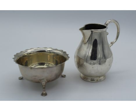A mid 18th century silver cream, London 1762, makers mark indistinct, together with a silver sugar, Mappin and Webb, Sheffiel