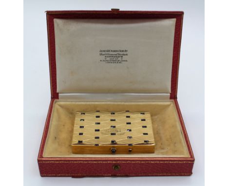 18 carat gold and sapphire compact in original slip and retailers box James Ogden and Sons, c.1925. Set with twenty seven sap