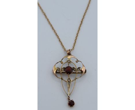 A 9ct Edwardian seed pearl pendant brooch on 9ct chain. Brooch 4 x 2.5cm. Total weight 4.8gm