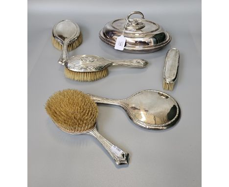 A collection of vanity wear to include five brushes and one mirror plus one Mappin and Webb silver plate warming dish