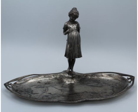 A WMF silver plated Art Nouveau dressing table tray, with young girl surmount and pierced dished organic base. Stamped 19cm h